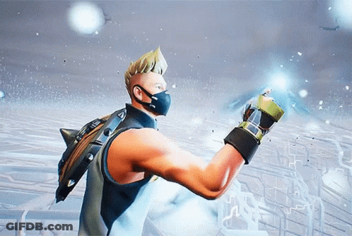 A Man Wearing A Mask And Gloves Is Standing In Front Of A Snowy Field GIF
