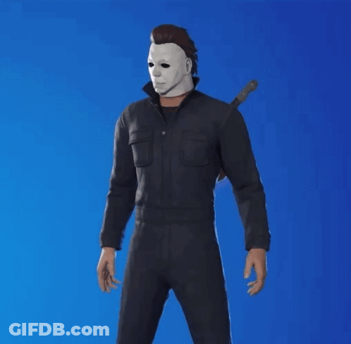 A Man Wearing A Mask And Holding A Knife Stands In Front Of A Blue Background GIF