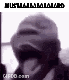 A Man Wearing A Mask Is Making A Funny Face . GIF