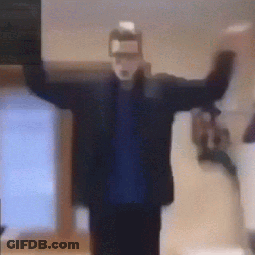 A Man Wearing A Mask Is Standing In A Room With His Arms Outstretched And A Bottle Of Milk In His Hand . GIF
