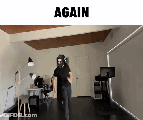 A Man Wearing A Mask Is Standing In A Room With The Word Again Above Him GIF