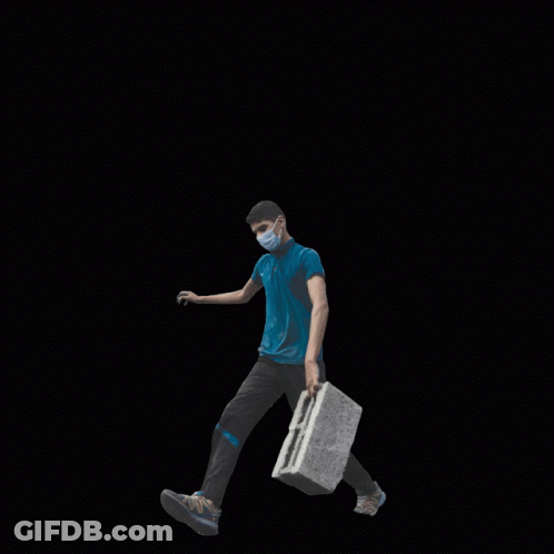 A Man Wearing A Mask Is Walking Through A Pile Of Rubble With The Words Invest In The People Not The War Behind Him GIF