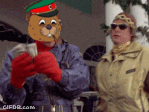 A Man Wearing A Mask Of A Beaver Is Holding A Bunch Of Money GIF