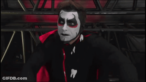 A Man Wearing A Mask Says Backlash In White Letters GIF