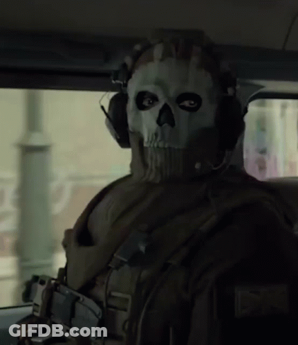 A Man Wearing A Mask With A Skull On It GIF