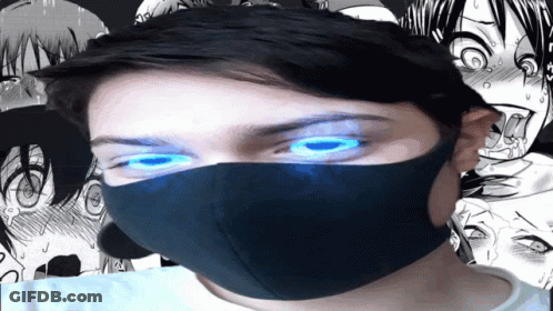 A Man Wearing A Mask With Blue Eyes GIF
