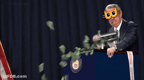 A Man Wearing A Mask With The Letter B On It Stands Behind A Podium GIF