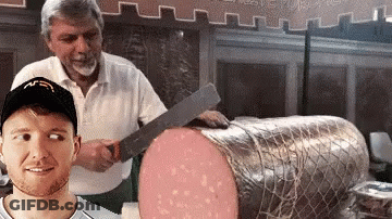 A Man Wearing A Mcdonald 'S Hat Is Standing Next To A Large Piece Of Meat GIF