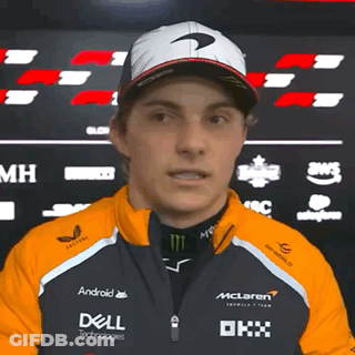 A Man Wearing A Mclaren Jacket And A Dell Jacket GIF