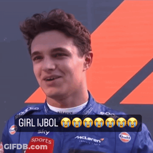 A Man Wearing A Mclaren Jacket Is Talking Into A Microphone While Crying GIF