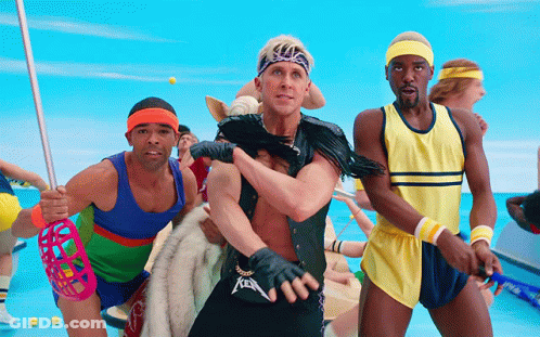 A Man Wearing A Metallica Belt Is Surrounded By Other People GIF