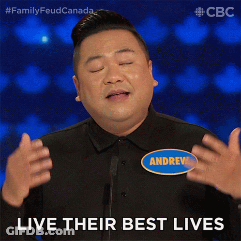 A Man Wearing A Name Tag That Says Andrew On It GIF