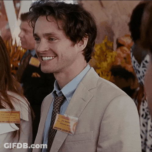 A Man Wearing A Name Tag That Says Chris Morgan On It GIF