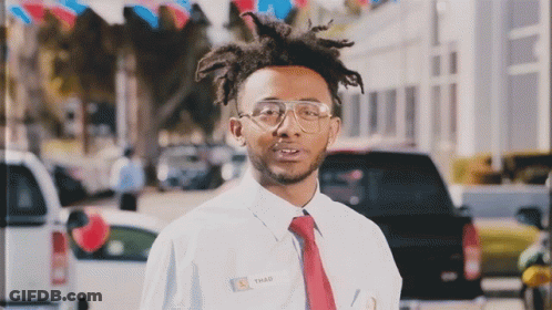 A Man Wearing A Name Tag That Says Shad GIF