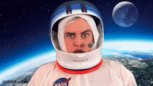 A Man Wearing A Nasa Helmet And A Nasa Shirt GIF
