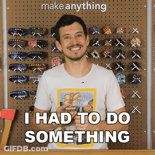 A Man Wearing A National Geographic Shirt Says " I Had To Do Something " In Front Of A Wall Of Hair Clips GIF