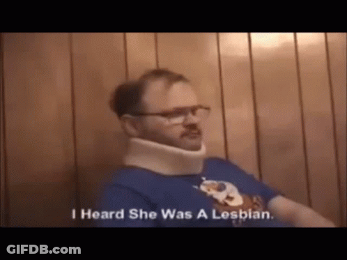 A Man Wearing A Neck Brace And Glasses Is Talking About Being A Lesbian . GIF