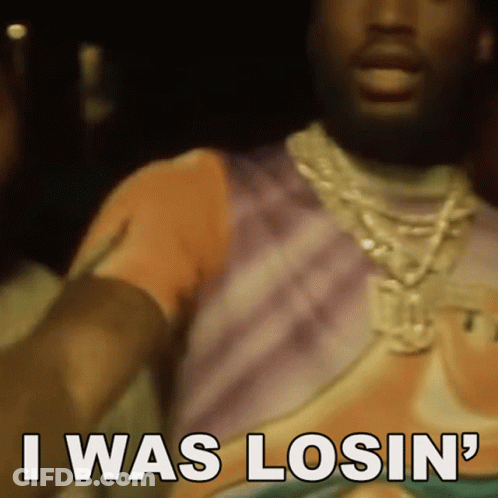 A Man Wearing A Necklace And A T-Shirt Is Saying I Was Losin ' GIF