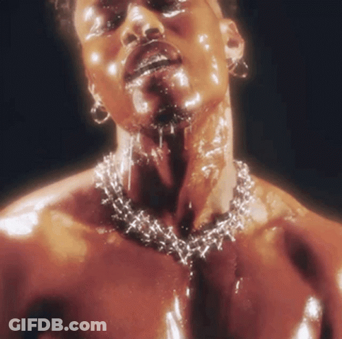 A Man Wearing A Necklace With Barbed Wire Around His Neck GIF