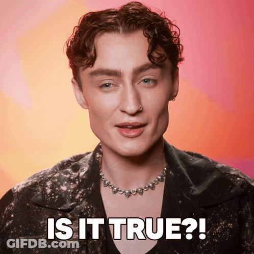 A Man Wearing A Necklace With The Words Is It True On The Bottom GIF