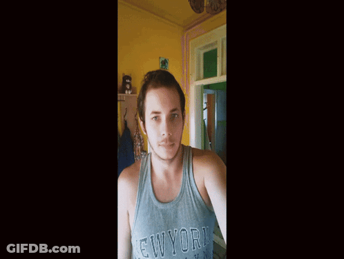 A Man Wearing A New York Brooklyn Tank Top GIF