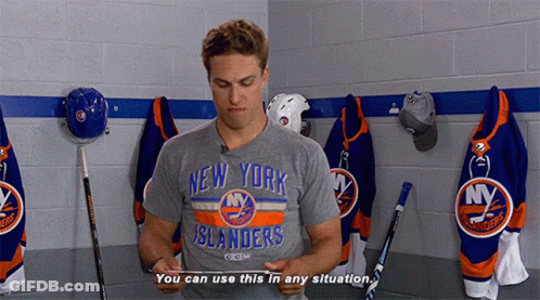A Man Wearing A New York Islanders T-Shirt Is Standing In A Locker Room GIF