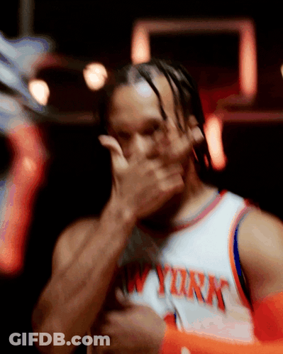 A Man Wearing A New York Jersey Covering His Face With His Hand GIF