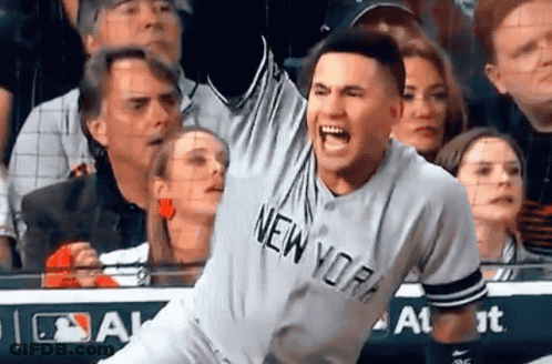 A Man Wearing A New York Jersey Screams In The Air GIF