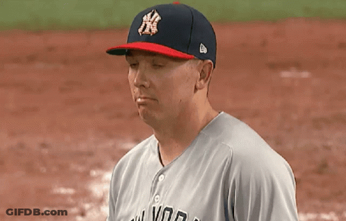 A Man Wearing A New York Yankees Hat Looks At Something GIF