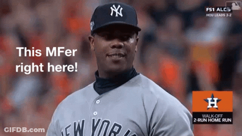 A Man Wearing A New York Yankees Jersey Is Standing In Front Of A Sign That Says This Mfer Right Here GIF