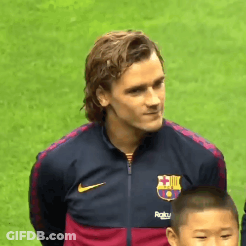A Man Wearing A Nike Jacket With A Fc Barcelona Logo On It GIF