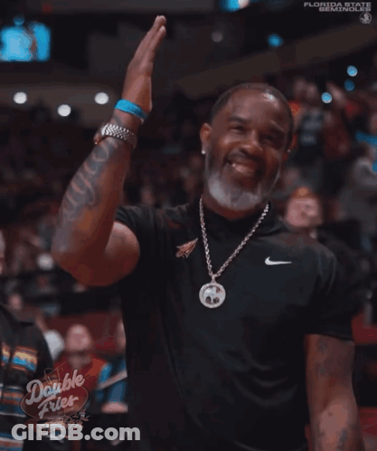 A Man Wearing A Nike Shirt And A Double Fries Sign GIF