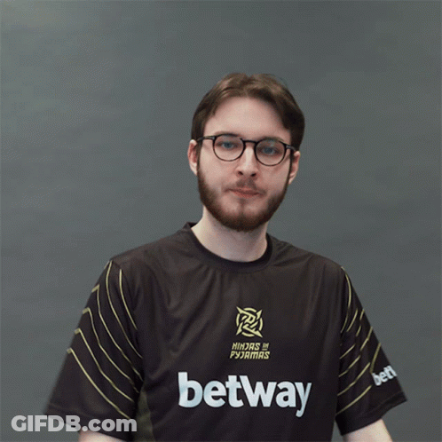 A Man Wearing A Ninjas In Pajamas Shirt Is Clapping GIF
