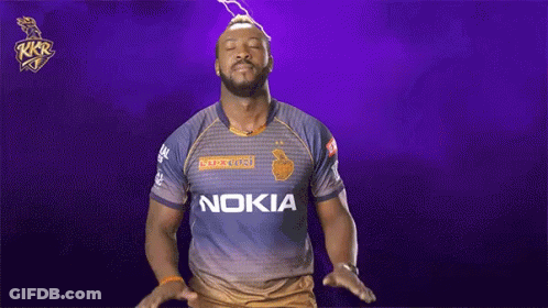A Man Wearing A Nokia Shirt Is Standing In Front Of A Purple Background GIF