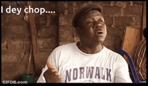 A Man Wearing A Norwalk Shirt Holds A Sandwich In His Hand GIF