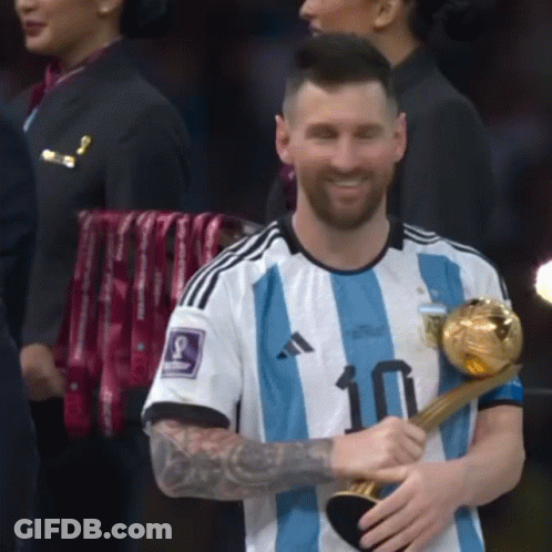 A Man Wearing A Number 10 Jersey Holds A Trophy GIF