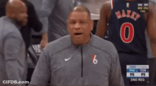 A Man Wearing A Number 6 Jersey Stands In Front Of A Basketball Player GIF
