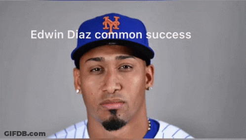 A Man Wearing A Ny Hat With The Words Edwin Diaz Common Success On The Bottom GIF