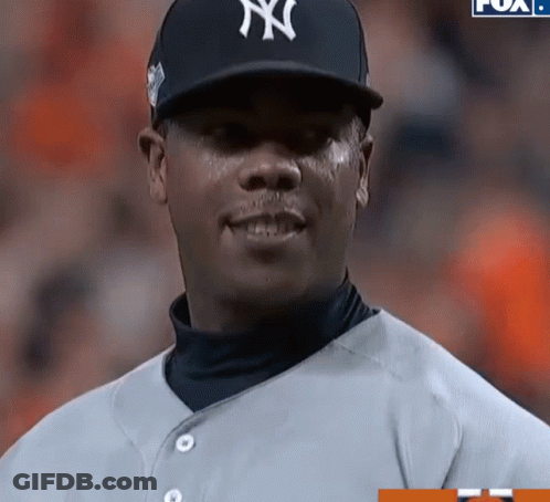 A Man Wearing A Ny Yankees Hat And Jersey GIF
