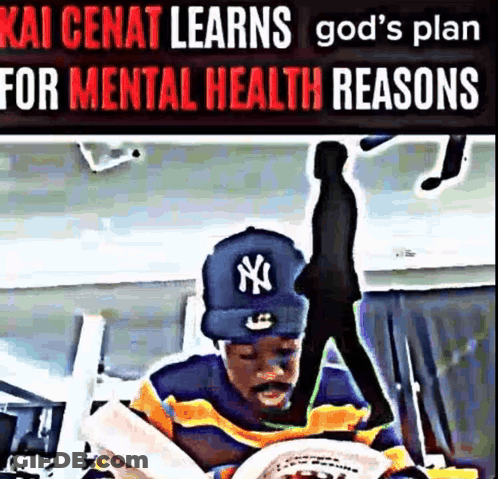A Man Wearing A Ny Yankees Hat Is Reading A Newspaper . GIF
