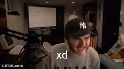Man With Yankees Hat Smiling In Front Of Microphone GIF