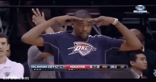 A Man Wearing A Oklahoma City Shirt Stands In Front Of A Fox Broadcast GIF