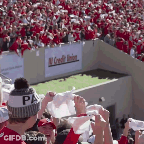 A Man Wearing A Pa Hat Holds Up A White Flag GIF