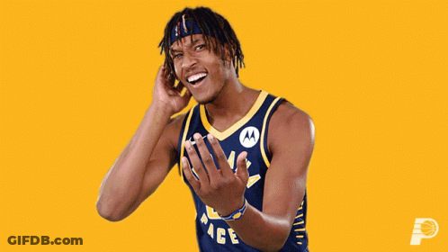 A Man Wearing A Pacers Jersey Is Laughing GIF