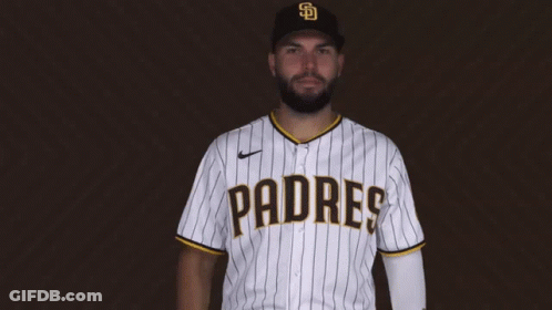 A Man Wearing A Padres Jersey Is Giving A Thumbs Up GIF