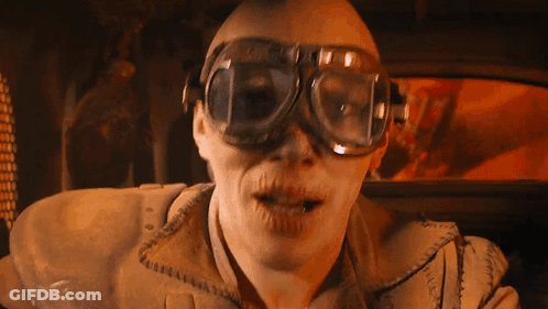 A Man Wearing A Pair Of Goggles Looks At The Camera With His Mouth Open GIF
