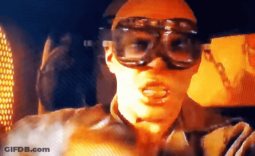 A Man Wearing A Pair Of Goggles With The Letter G On Them GIF