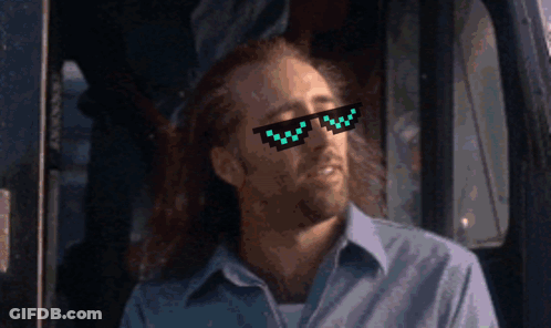 A Man Wearing A Pair Of Pixelated Sunglasses Looks To His Left GIF