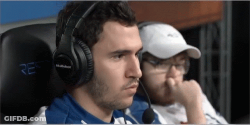 A Man Wearing A Pair Of Skullbox Headphones Sits In A Chair GIF