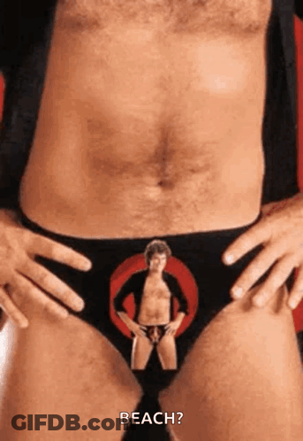 A Man Wearing A Pair Of Underwear With A Picture Of A Man In A Circle On It . GIF